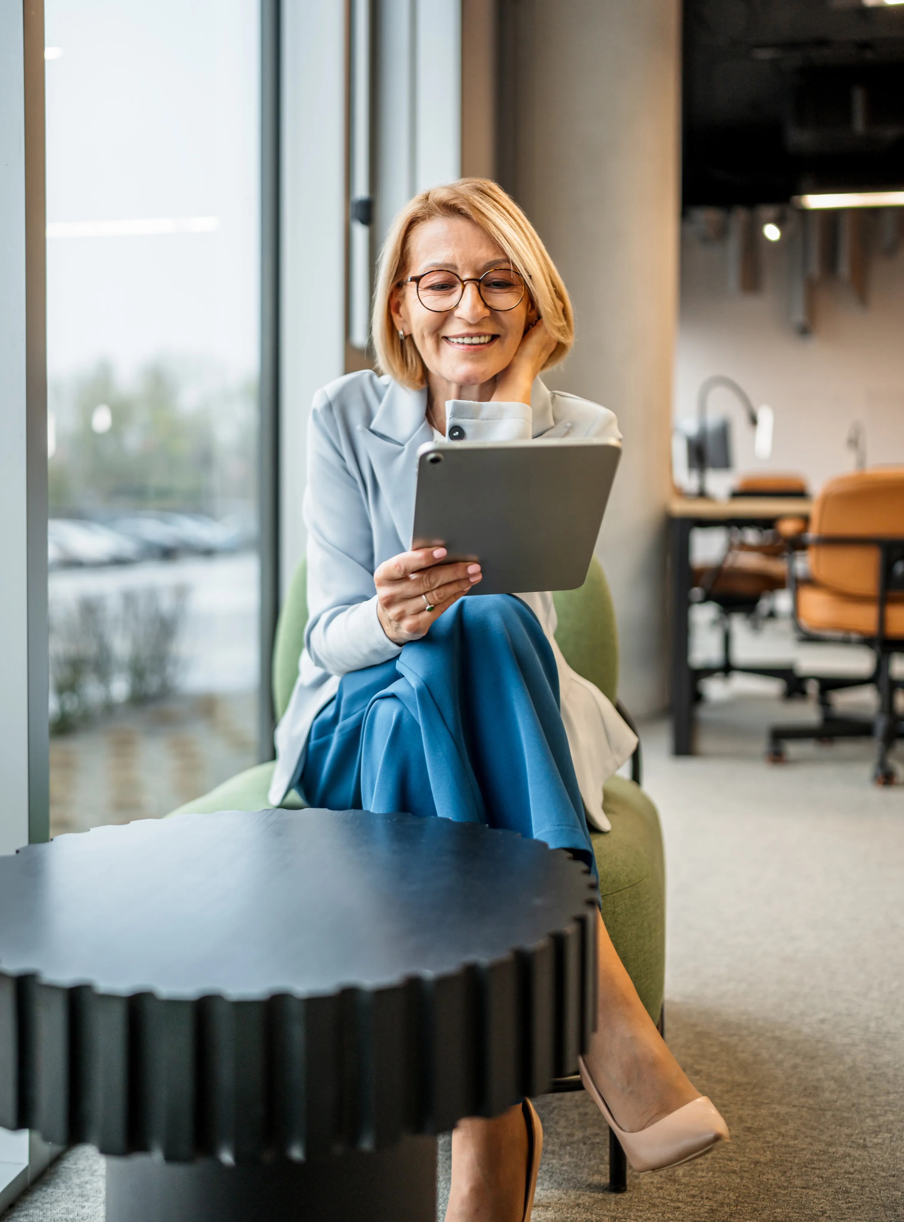 A Members Health Plan advisor reviewing plan details on a tablet